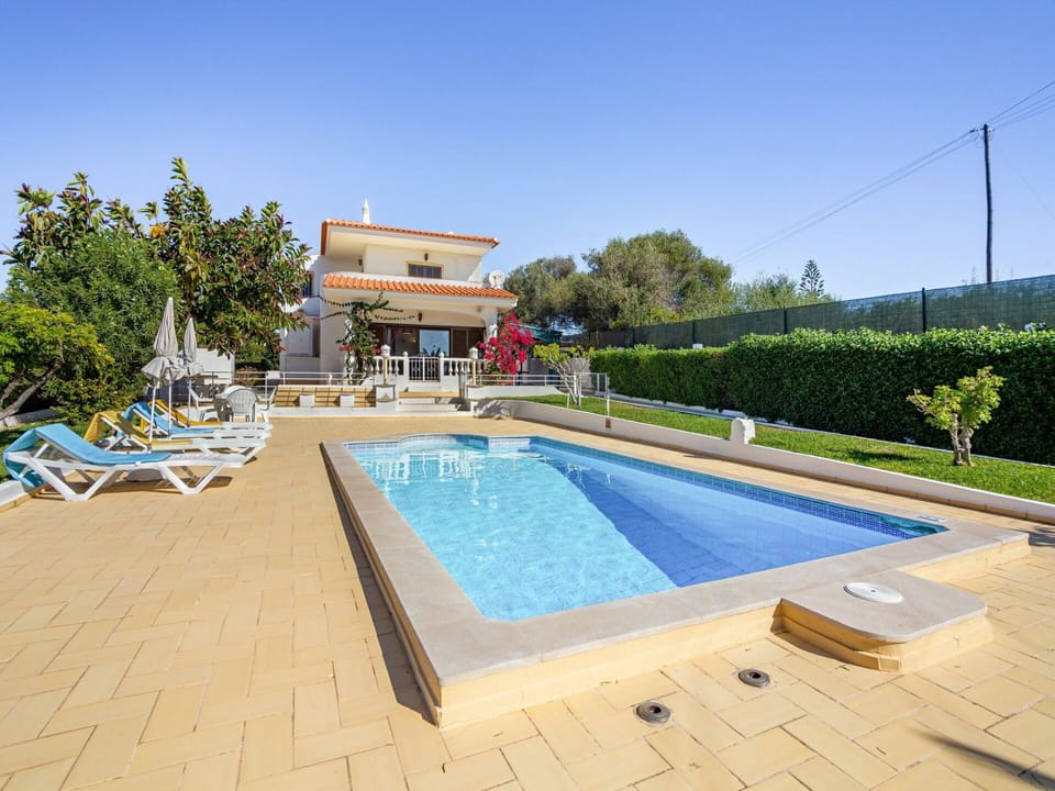 Sky, Water, Property, Building, Plant, Swimming Pool, Shade, Tree, Outdoor Furniture, House