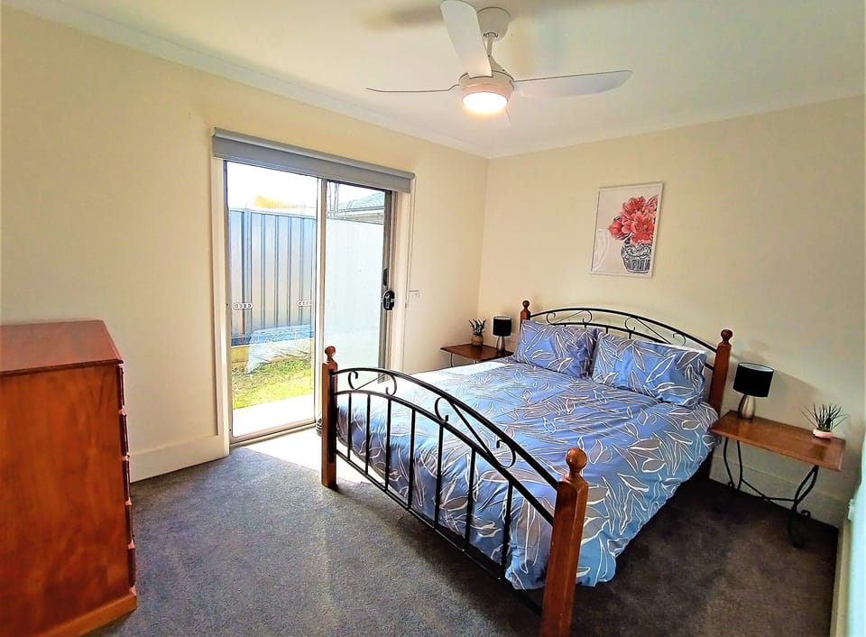 Bed 3 - with queen bed and chest of drawers. Note located through dining area.