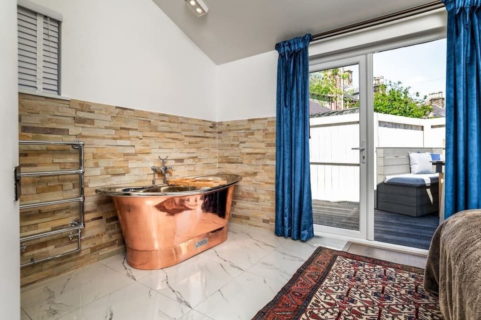 A bathtub by your bed! Super Sized copper tub luxury.