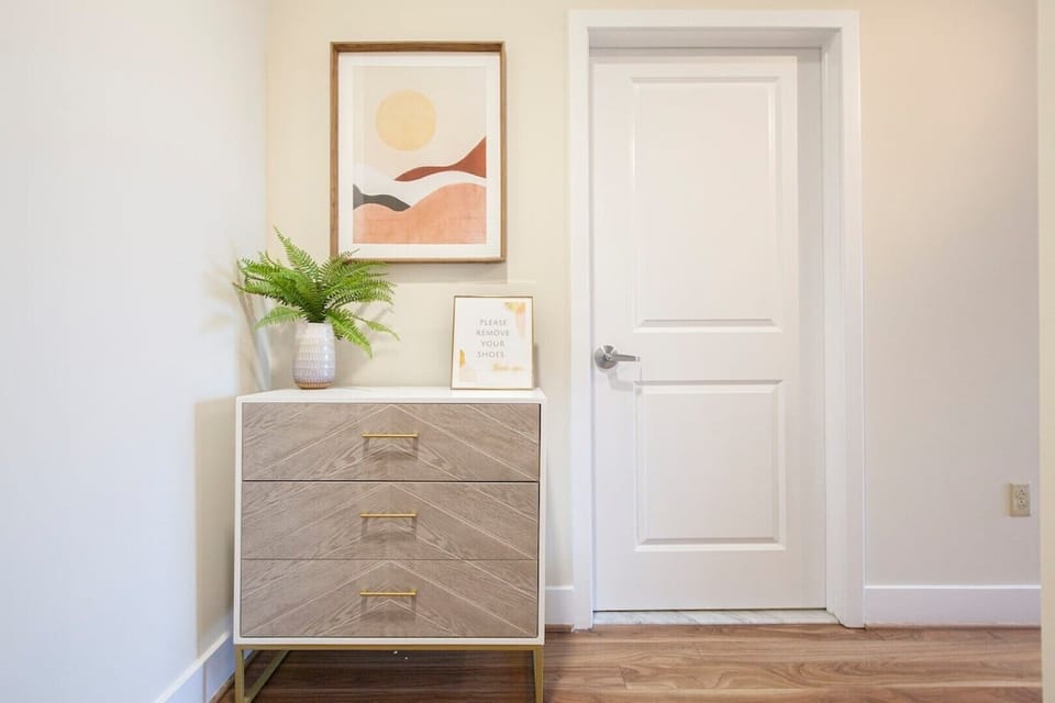 Bathroom entry -- located in the hallway between the entryway and kitchen area.