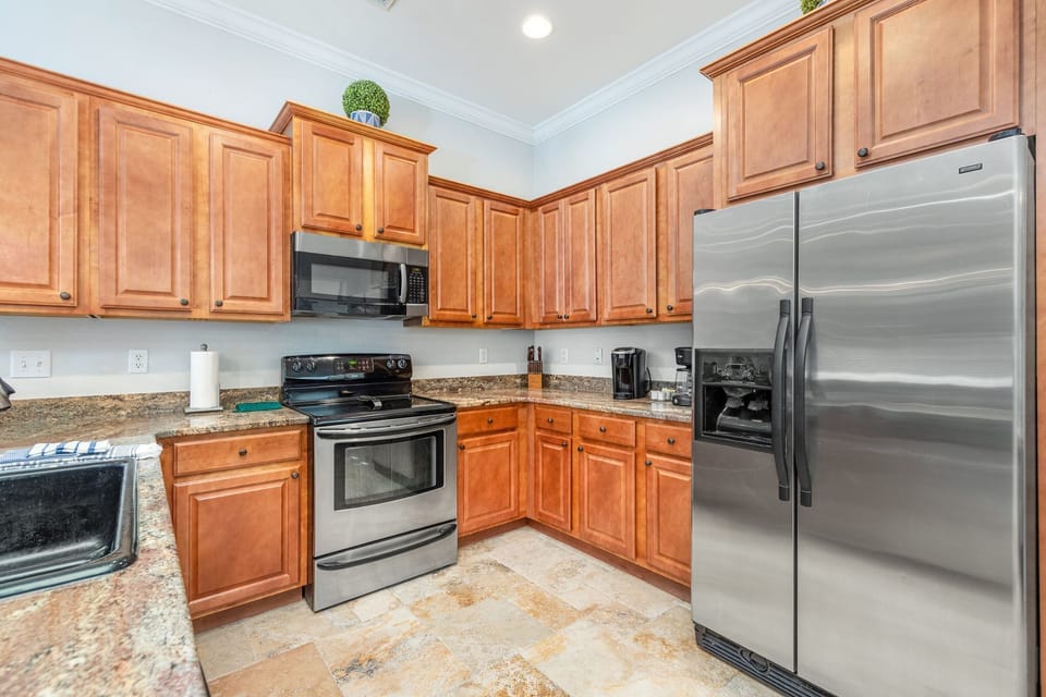 Fully stocked kitchen with pots, pans, blender, toaster, drip and kureg coffee machines
