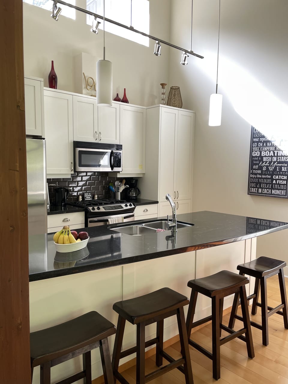 Or belly up to the granite topped island with gas stove.