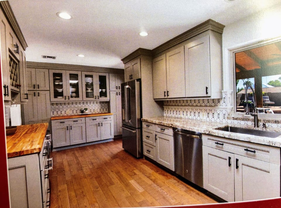 Luxury kitchen with view of pool and fire-pit.