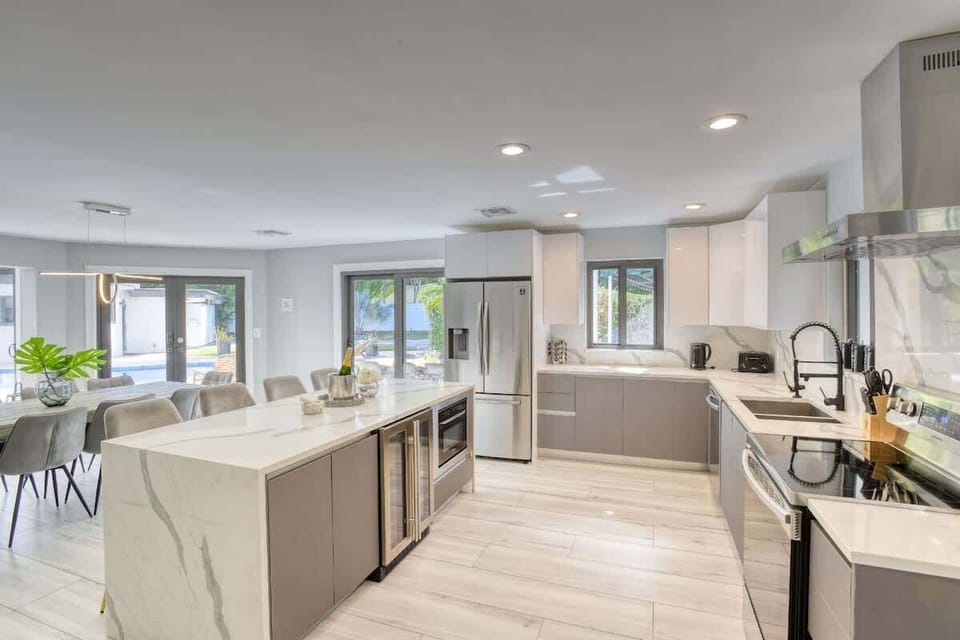 House 1 kitchen with everything you need including stainless steel appliances and wine fridge