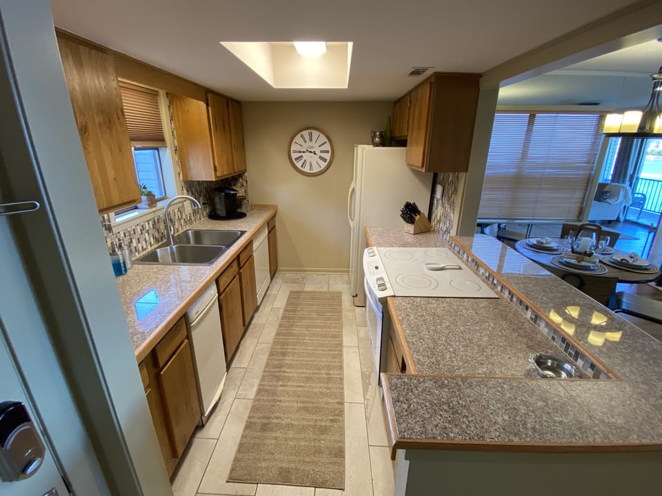 Fully stocked kitchen including coffee makers, kitchen appliances, and much more