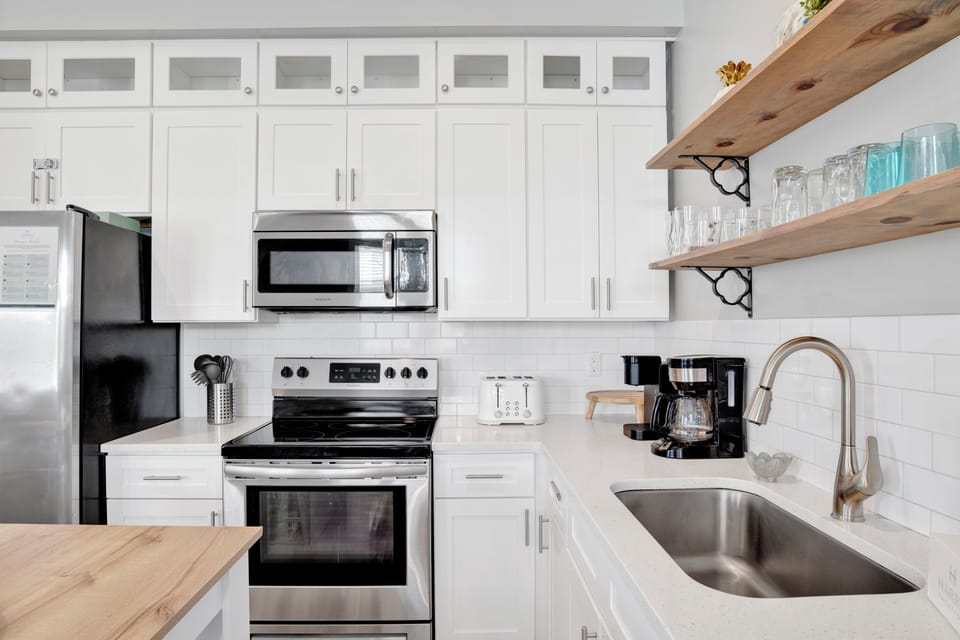 Stainless steel appliances and stone counters