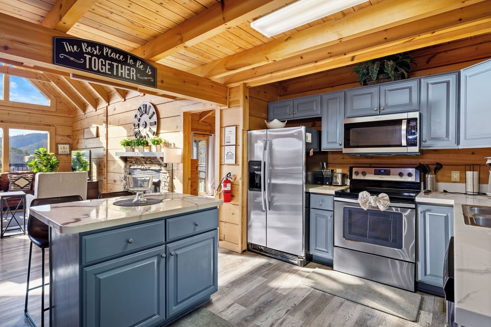 Fully equipped kitchen w/ refrigerator, stove, oven, microwave, coffee maker.