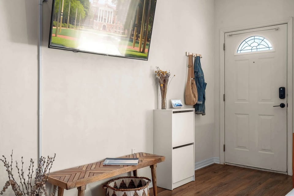 Step into comfort—our stylish entryway features smart lock access, a cozy bench, and thoughtful touches to make arrivals easy and inviting.