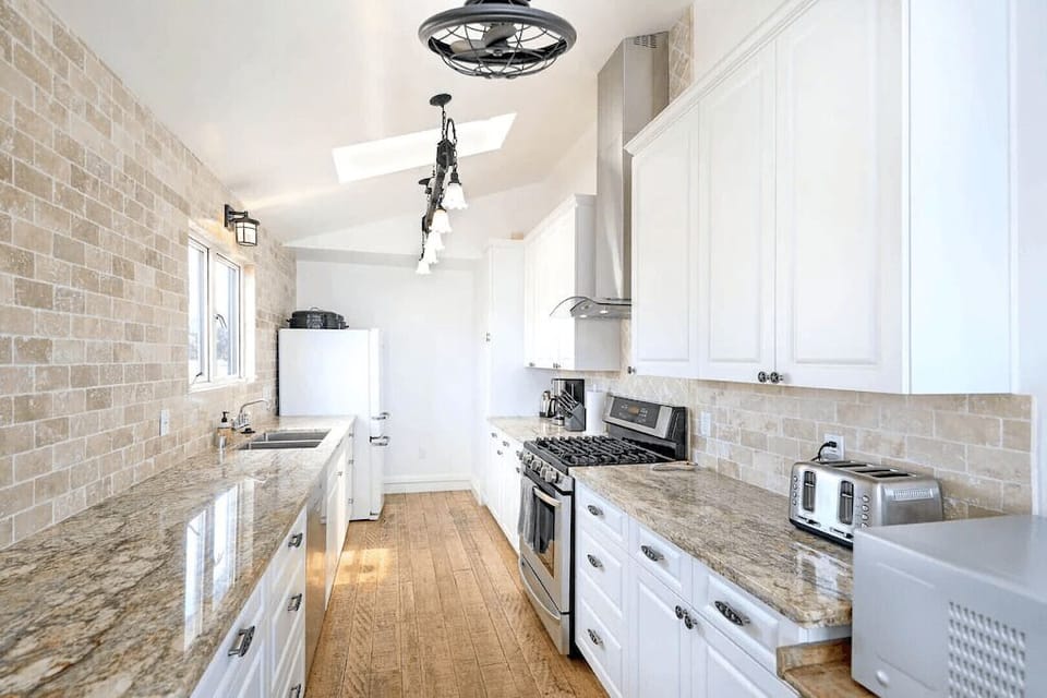 The kitchen is tastefully designed. It opens to the dining and living areas, so no home chef is left out of the fun!
                