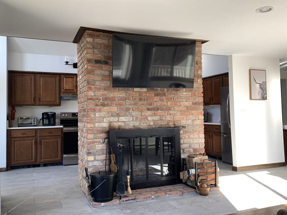 Build a fire while the chef cooks in the open concept kitchen and living room