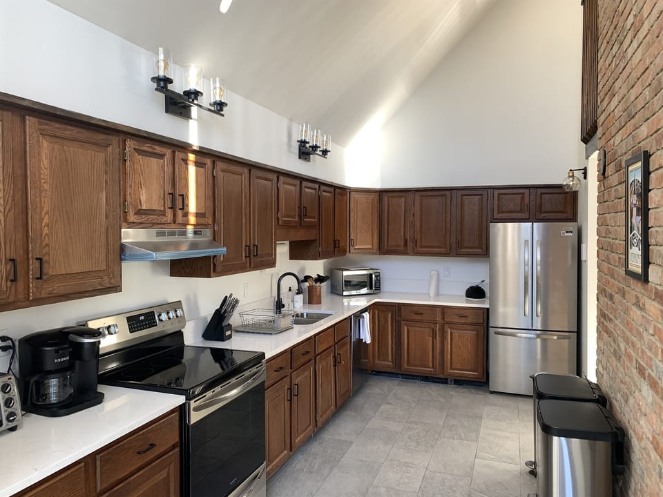The kitchen is well stocked and includes new appliances