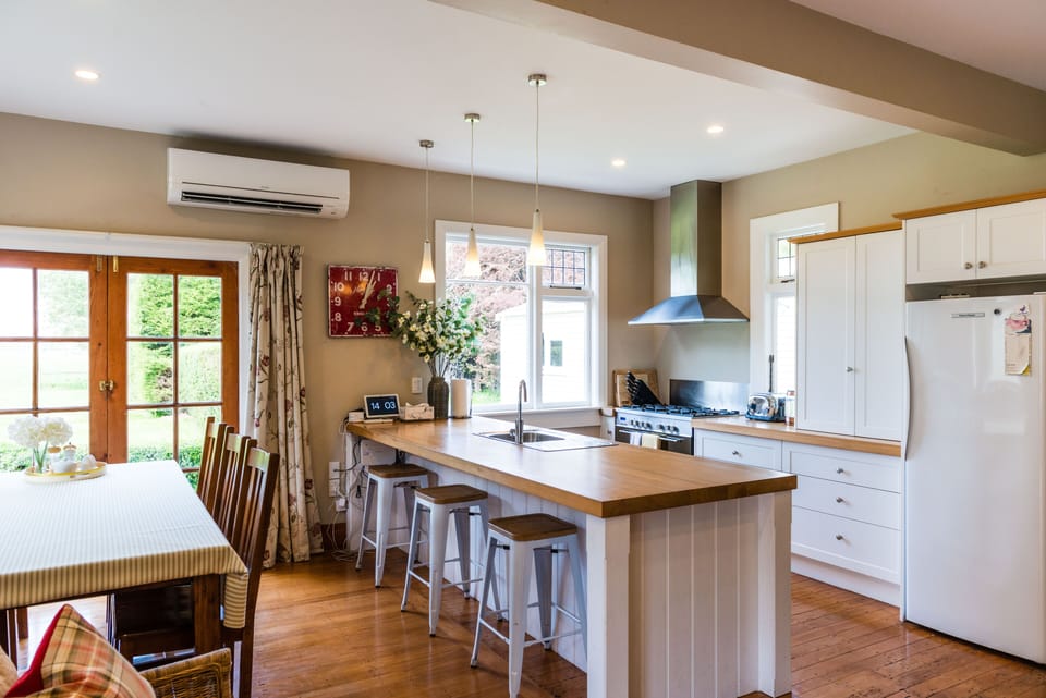 Kitchen / dining area showing fridge. Freezer is to the right in the entryway