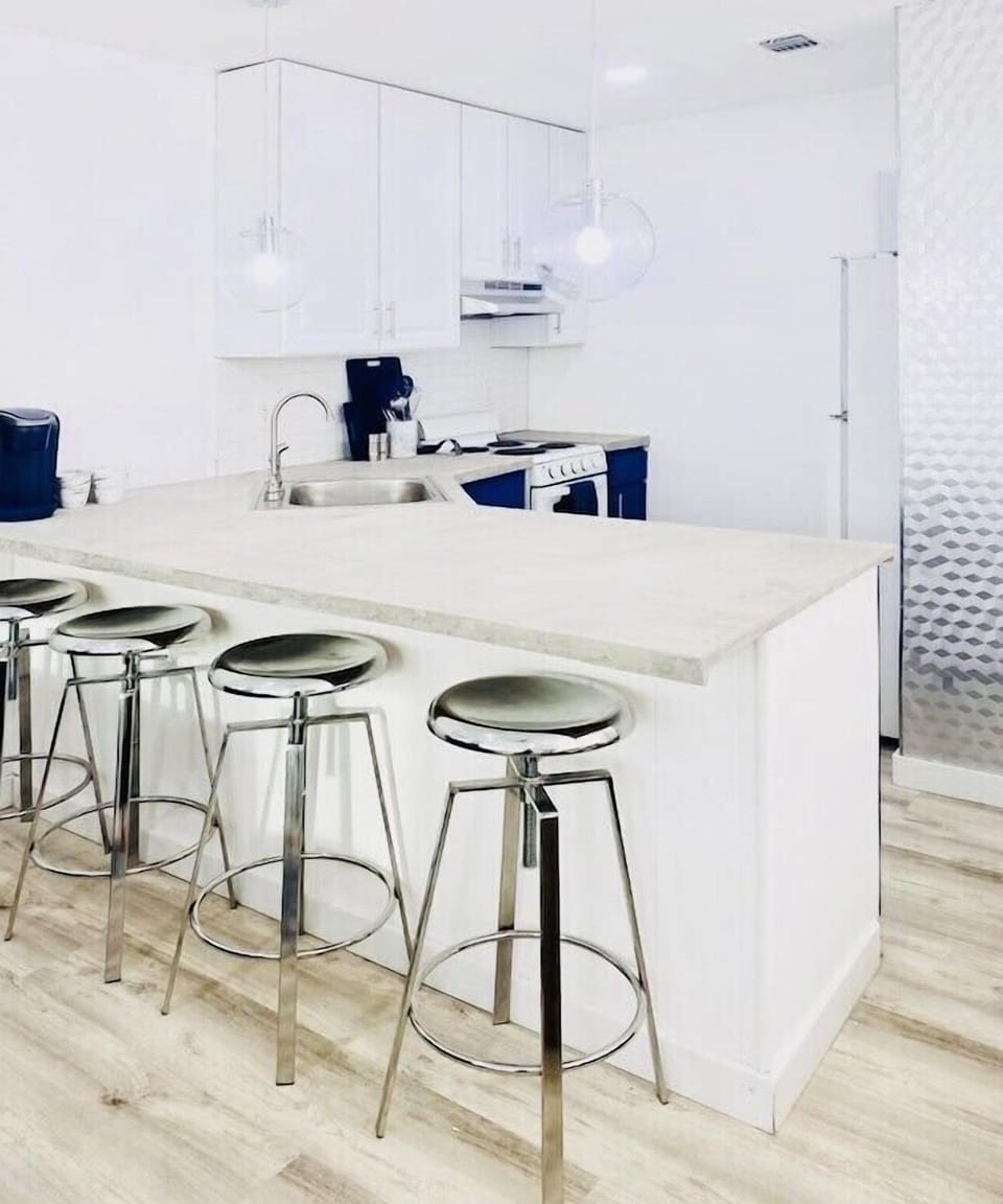 Ample seating at the modern concrete countertop.