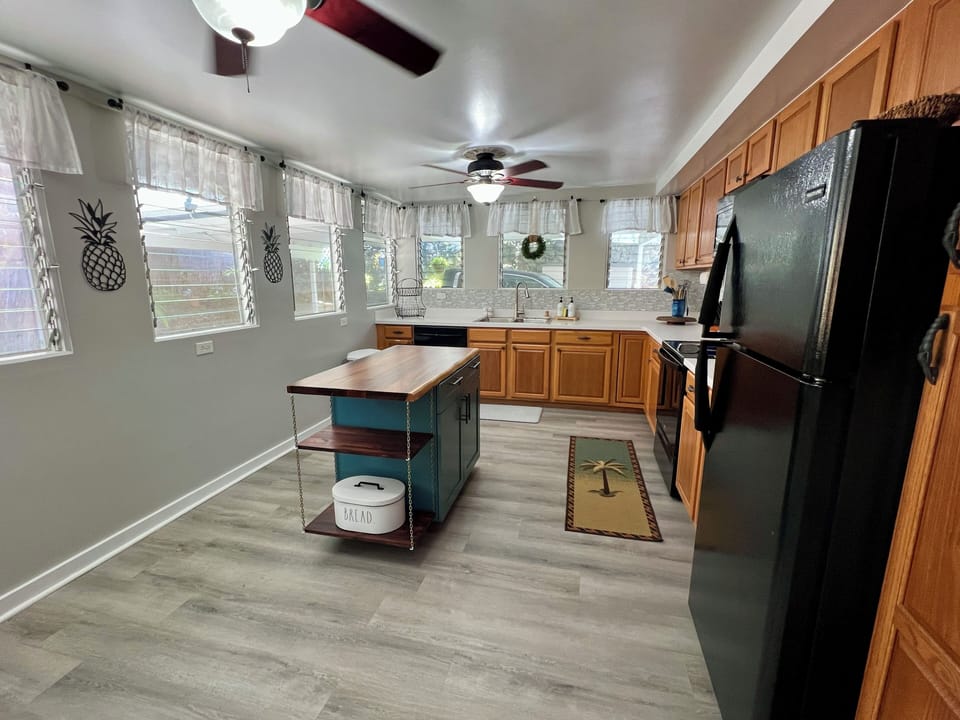 Spacious, fully-stocked kitchen.