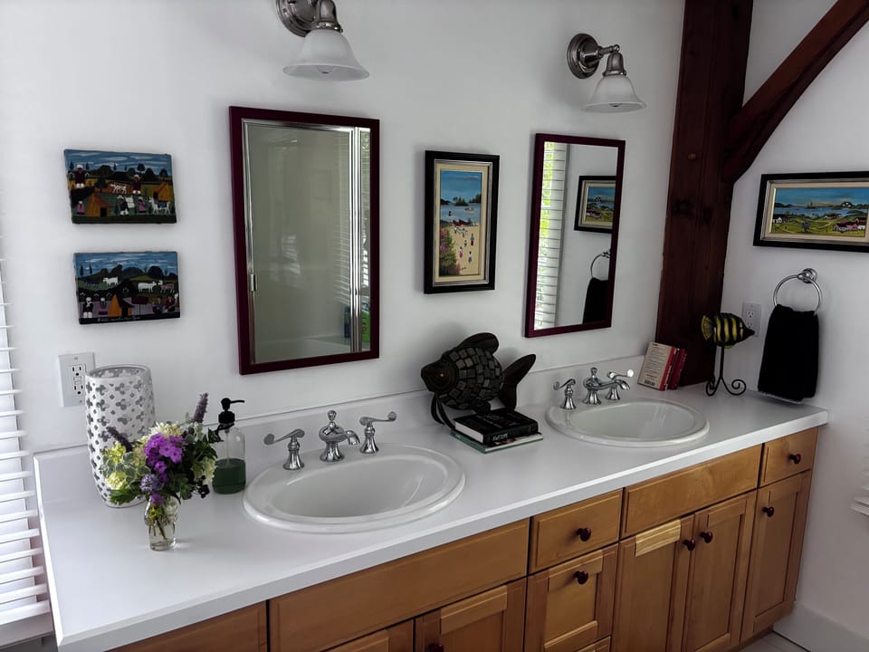 Downstairs bathroom.  Shower stall and washer dryer.