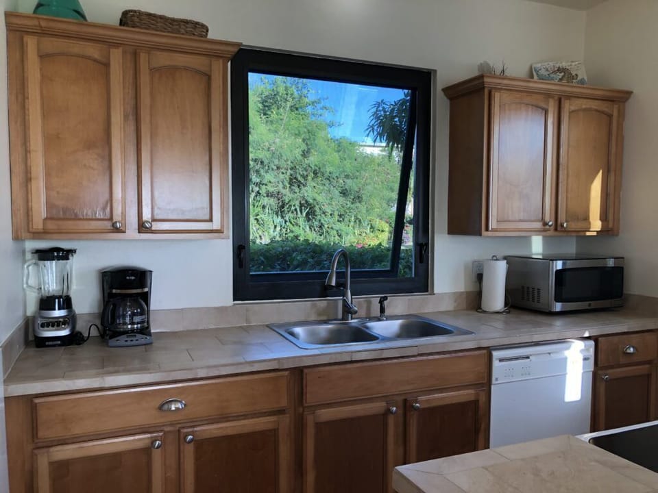 Kitchen: Bright and functional space with modern appliances and stunning nature views!