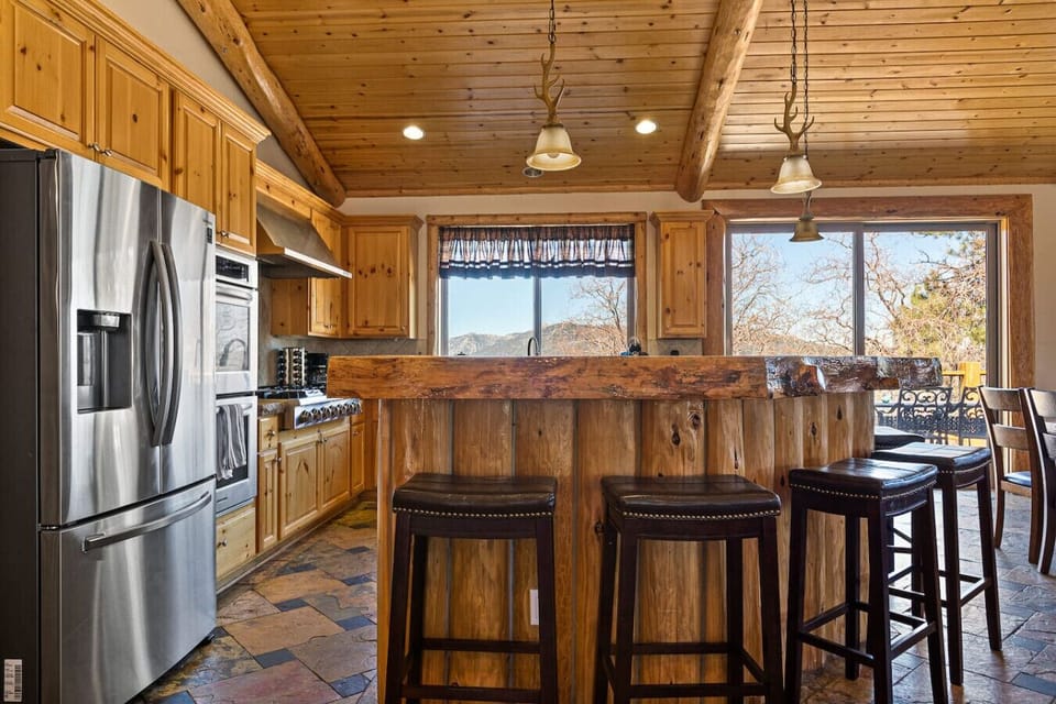 Six bar stools are positioned at the bar to accommodate your group.