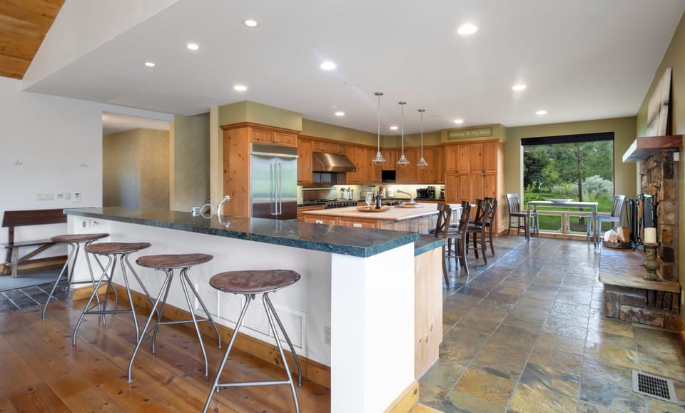 Plenty of storage, 2 sinks, Side-by-Side Refrigerator &10 bar stools for seating