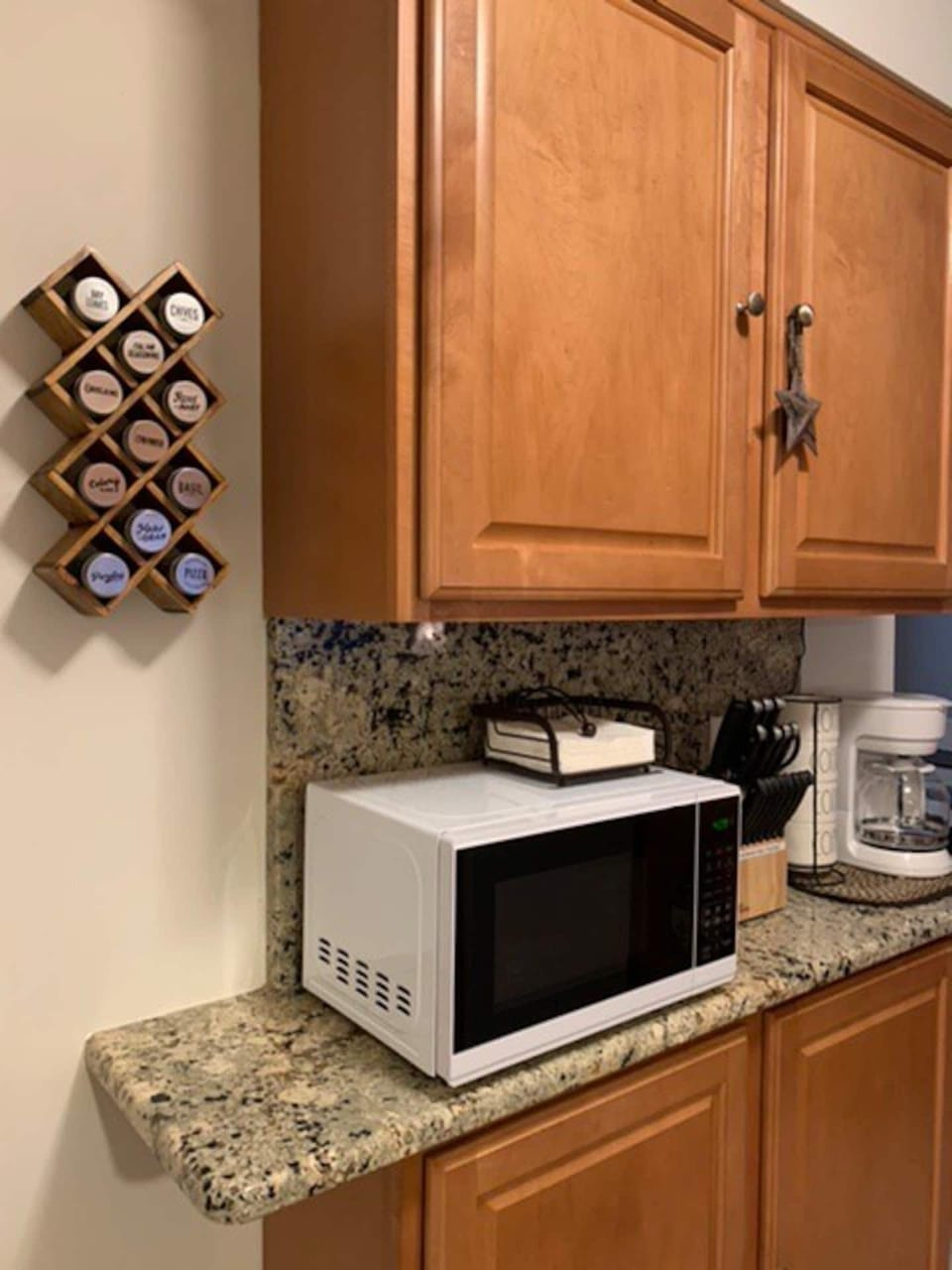 Another view of the additional kitchen counter space. Microwave, knife set, etc.