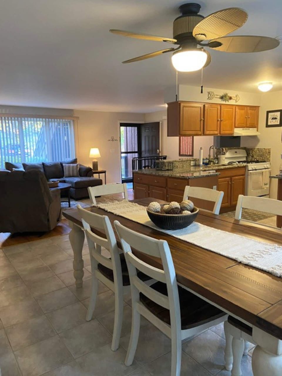Dining room table accommodates 8 people comfortably. Looks out to the kitchen.