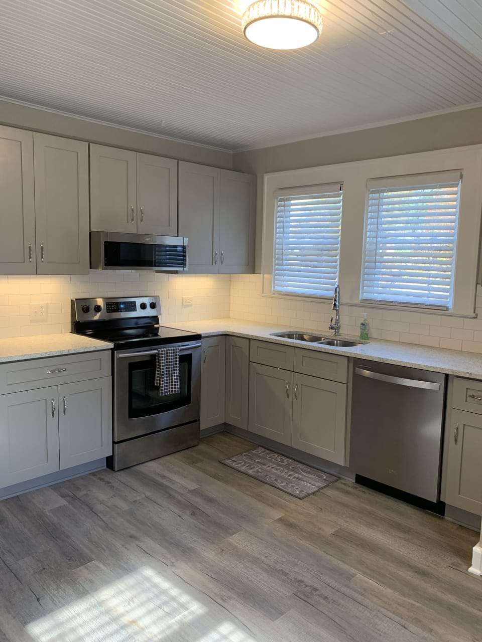 Updated kitchen with quartz counter tops.