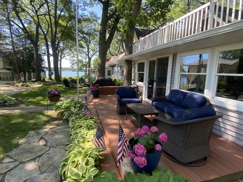 Gorgeous Lake Views from the front entrance deck and Firepit area! Walking path.