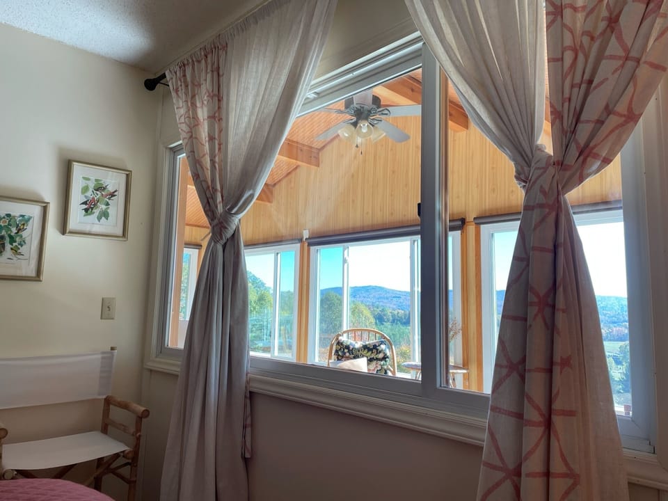 View of sunroom and mountains 