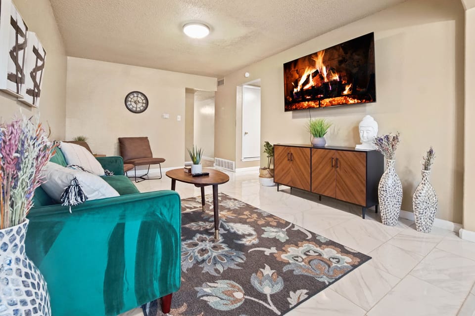 The living room’s 55" Smart TV is equipped for streaming your fav shows