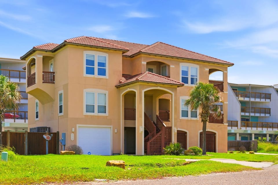 Front Exterior — Three-Story Beach Home, Blue Sky Day
