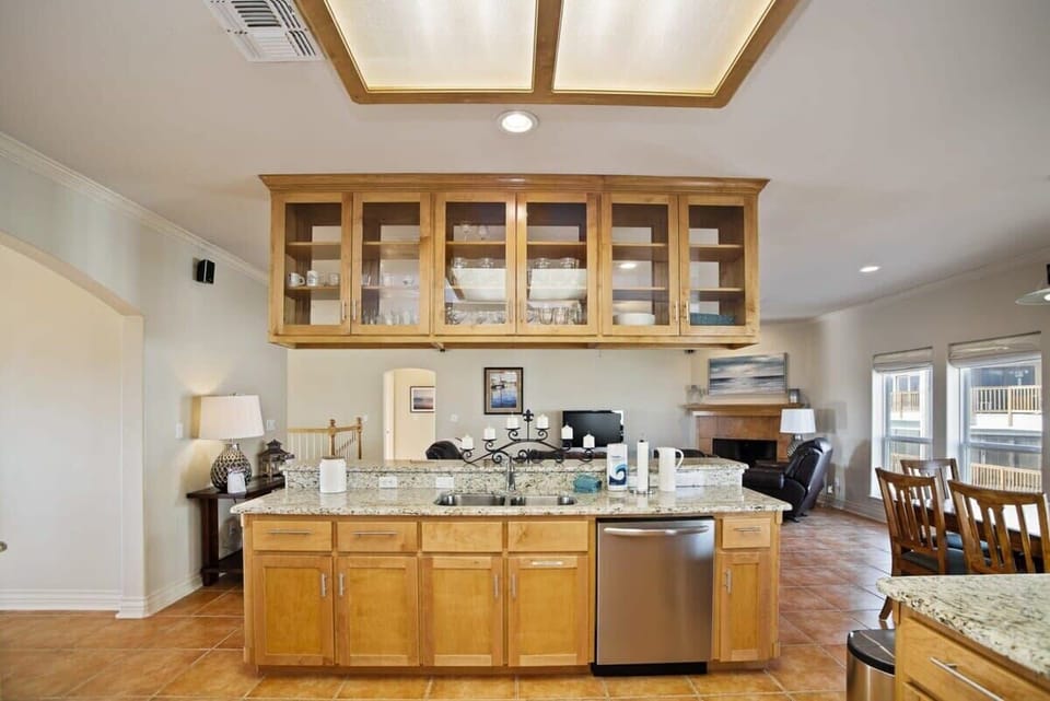Kitchen — Glass-Front Cabinets & Granite Countertops