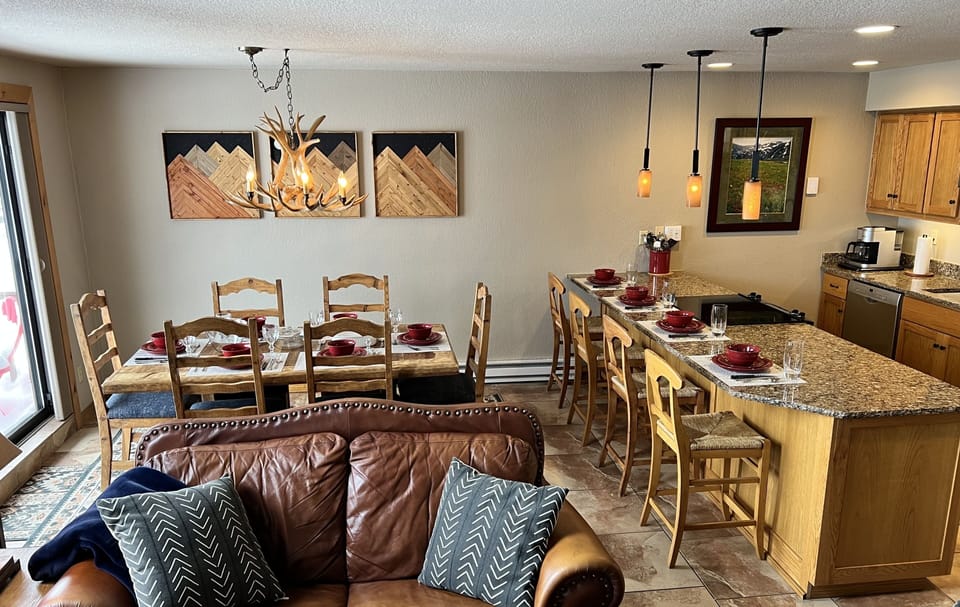 Dining table seats 6, plus counter height bar has seating for 4 more. 