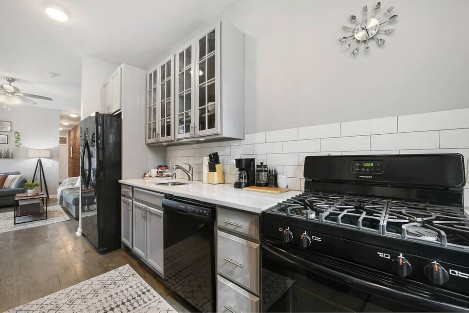 Modern kitchen with stainless steel appliances and ample counter space.