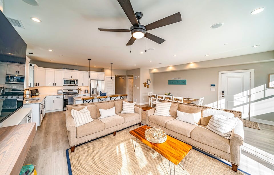 Comfortable and new! Open concept living and dining room with 65 inch ROKU HDTV!