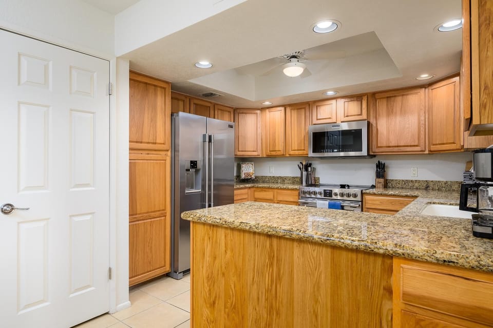 Updated kitchen has granite counter tops.