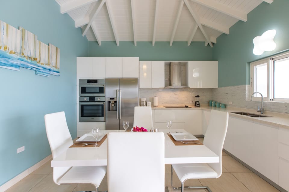Dining table that can fit up to 6 persons. Extra chairs are provided. 