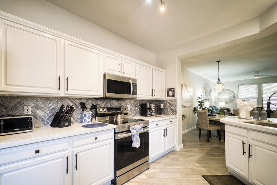 Generous counter space, stainless appliances, and an open layout.