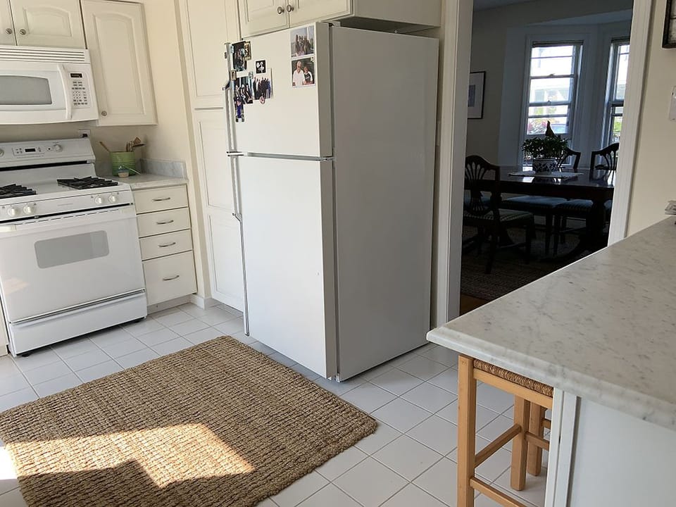 Dining room flows to kitchen. Marble counters, Gas stove & dishwasher