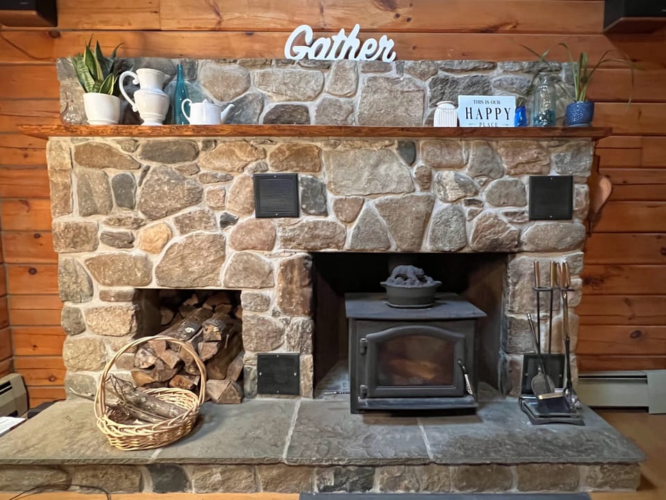 Wood-burning fireplace with cast iron insert will keep you toasty.