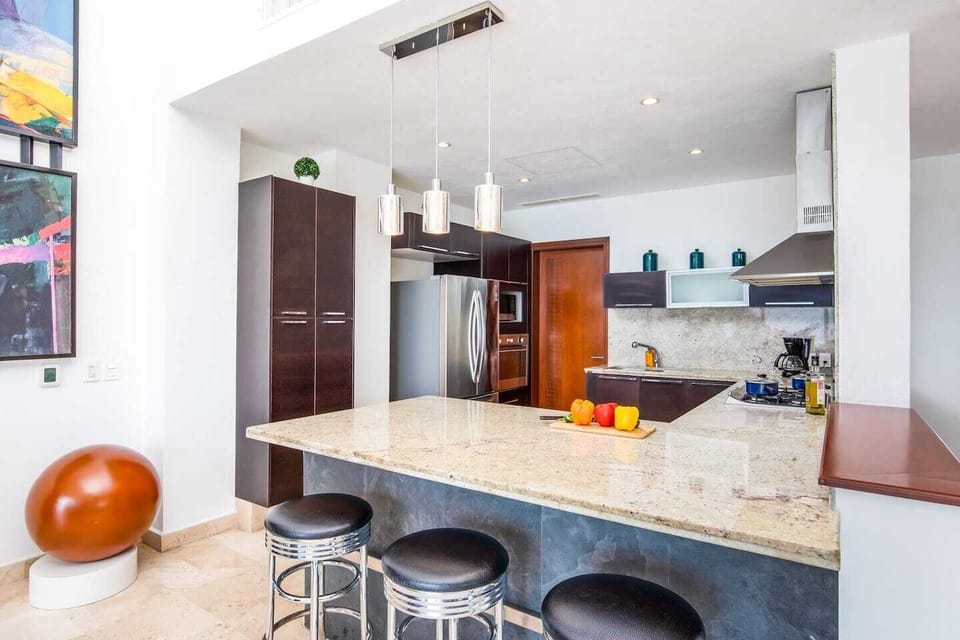 Plenty of room in the generous kitchen for preparing a meal or feeding the family a quick breakfast at the kitchen island. 