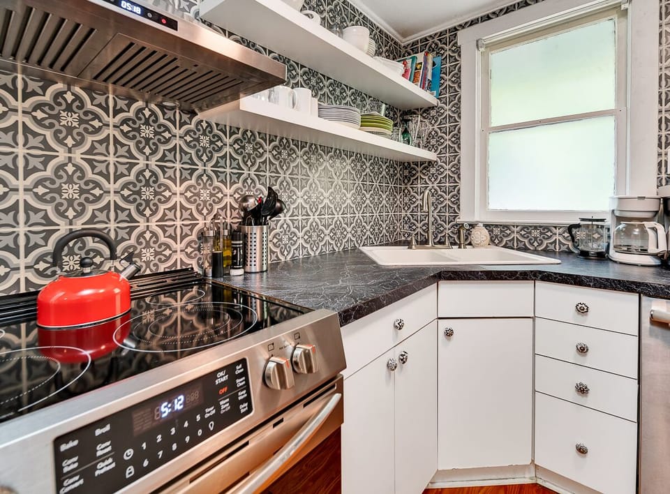 This kitchen includes a full range of the necessary appliances.