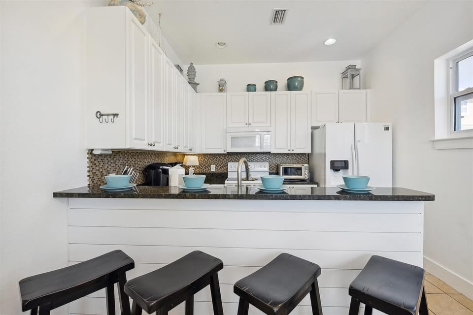 3rd Floor Full Size Kitchenw with Bar Seating
