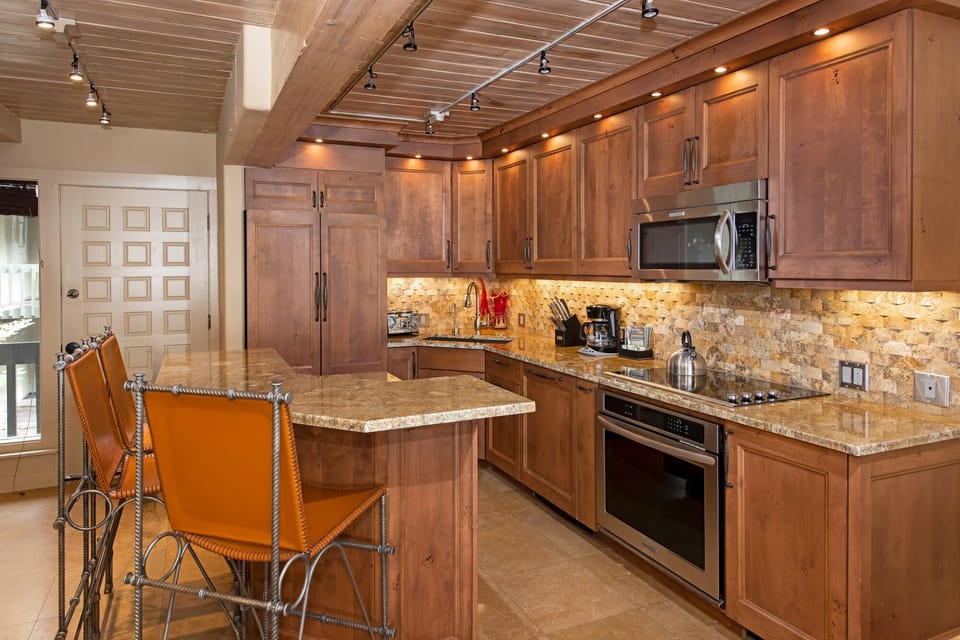 Spacious Kitchen w/ updated stainless appliances. Island / bar top cabinet space