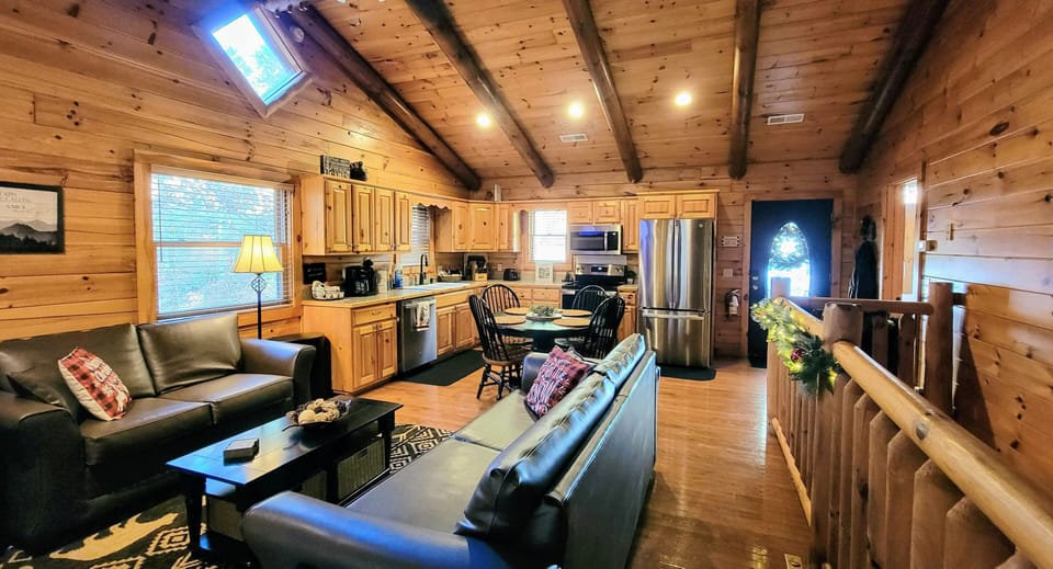 The main level living room and kitchen, from the door to the back deck