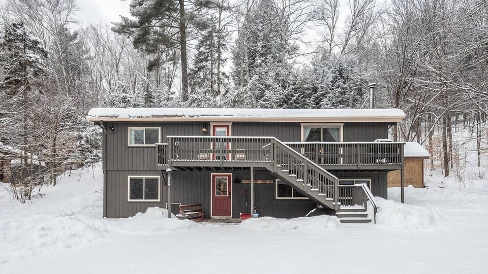The front of cozy Between the Pines after a snow fall. The home is shoveled for your arrival and plowed after significant snow. 