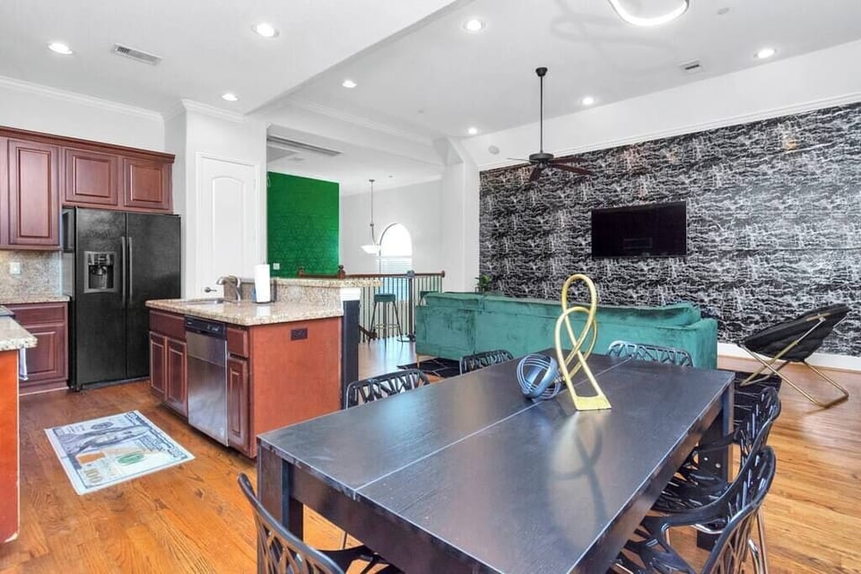 Dining table conveniently located near the kitchen and living room spaces