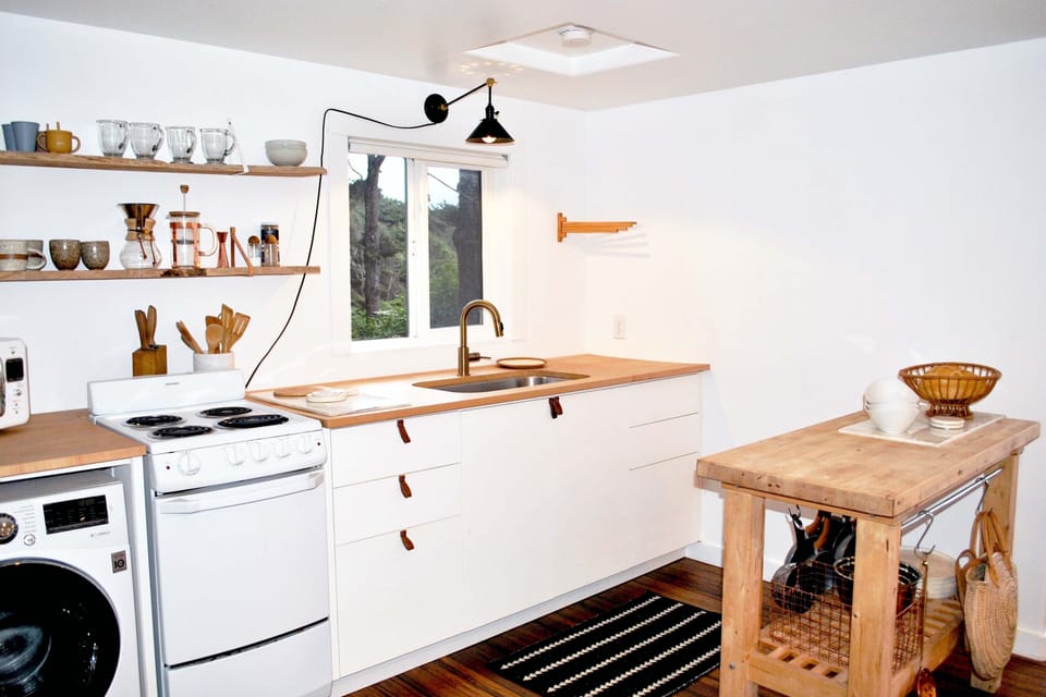 The compact kitchen is perfect for this space.