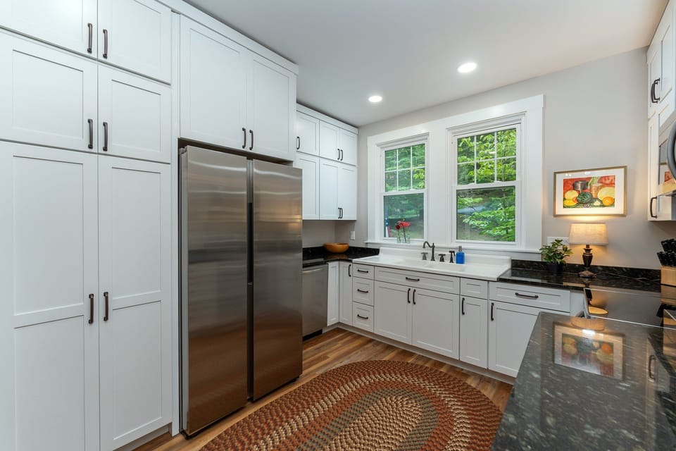 All new kitchen and appliances on the main level with bar seating for 3, dishwasher, and libation station.