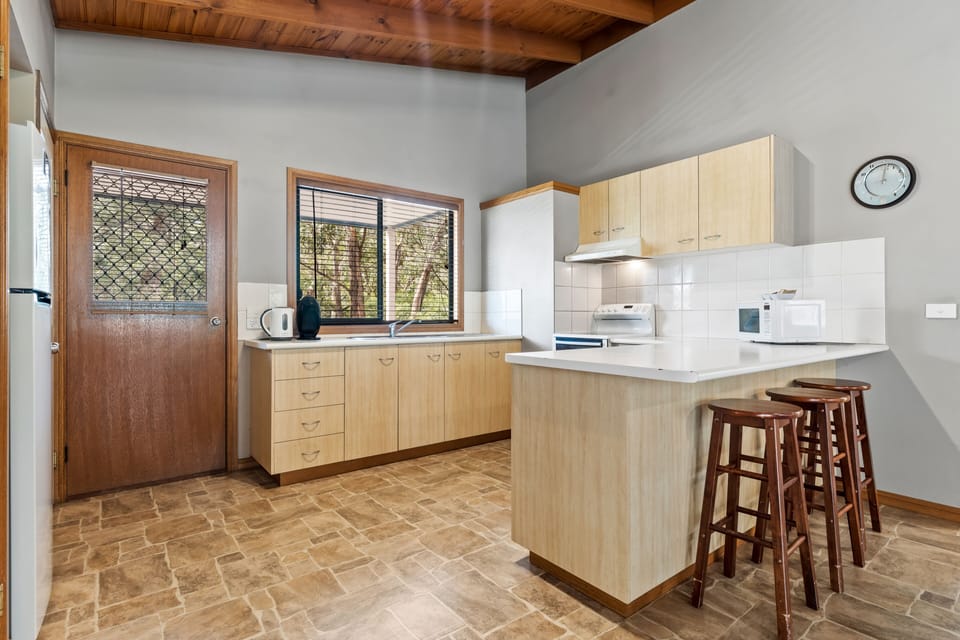 Experience joy in our fully equipped kitchen, a culinary haven for a delightful stay.