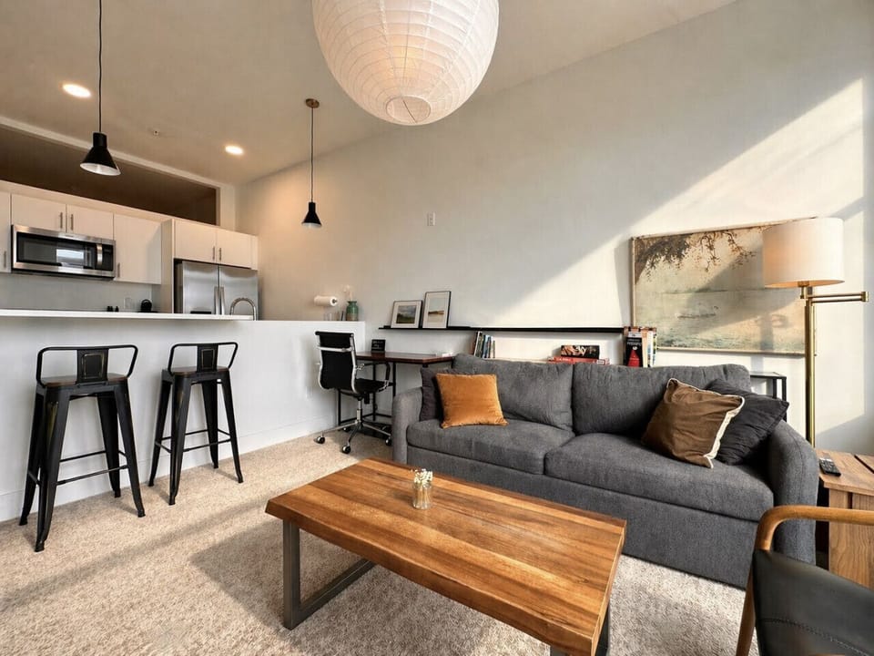 This open, light-filled space is perfect for lounging, working, or refueling after a day exploring the city