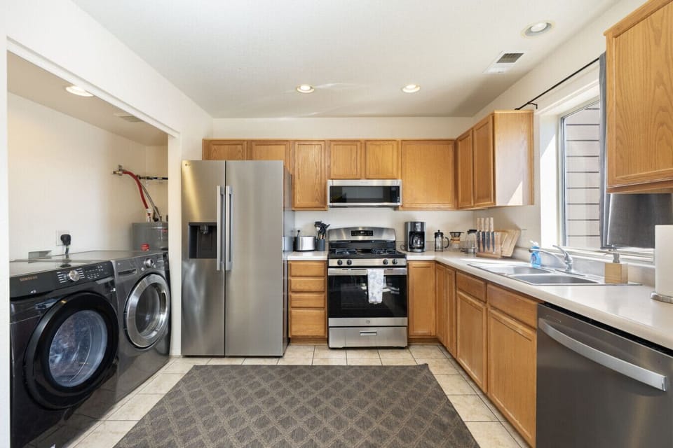 Refreshed kitchen with stainless appliances, in-home laundry, and room to spread out.